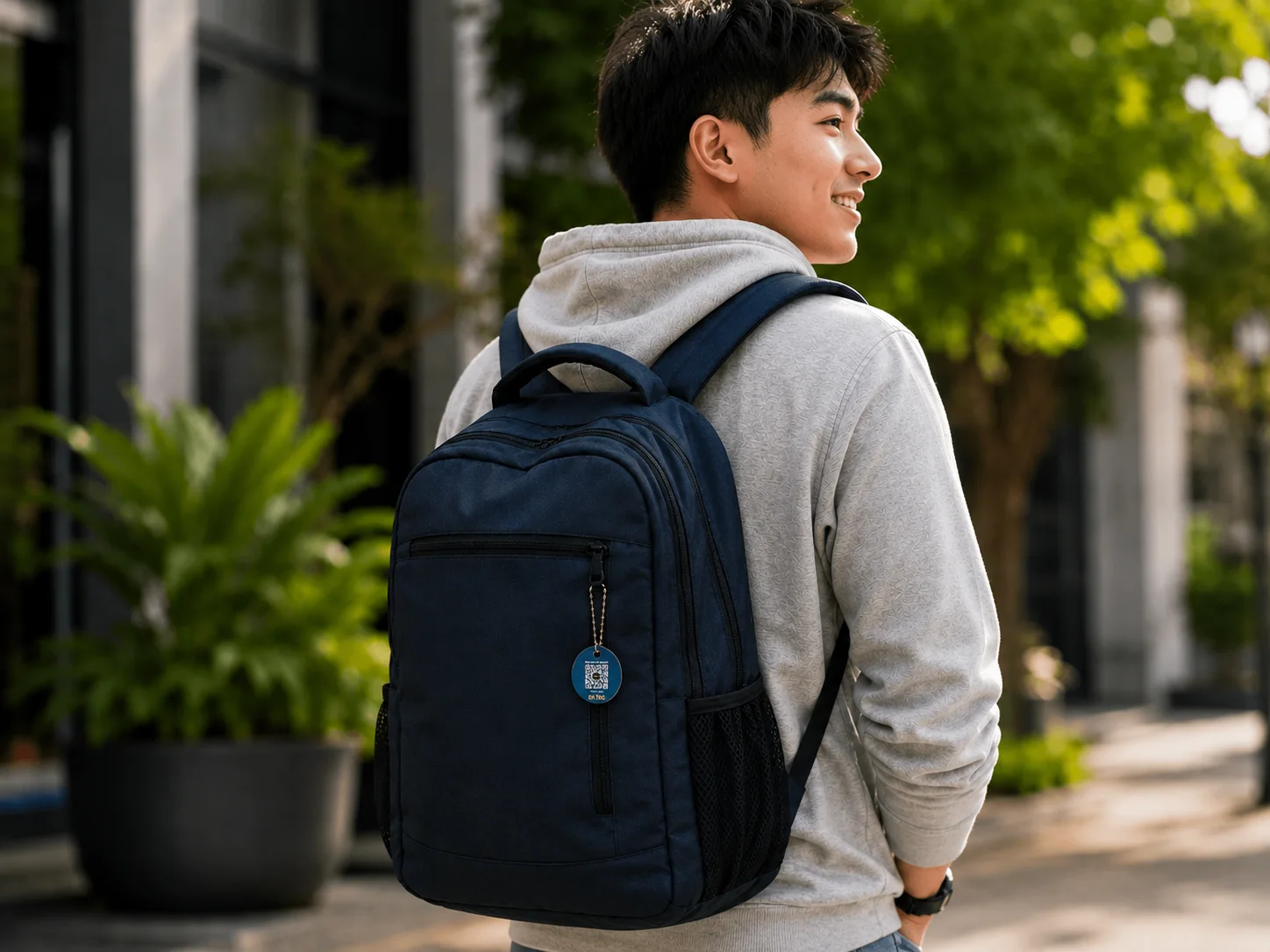 EkTag QR luggage tag on a travel backpack for daily commuters